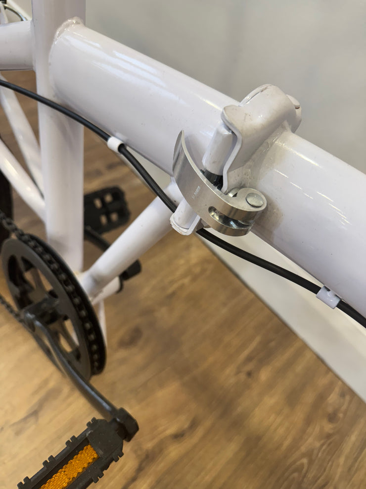 Folding white bike